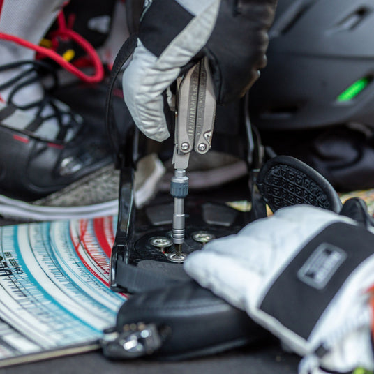 Translation missing: en.Person using Charge TTi with Ratchet Driver on a snowboard