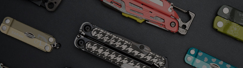 Translation missing: en.A selection of Leatherman multi tools featuring different styles and sizes, is showcased on a table for viewing