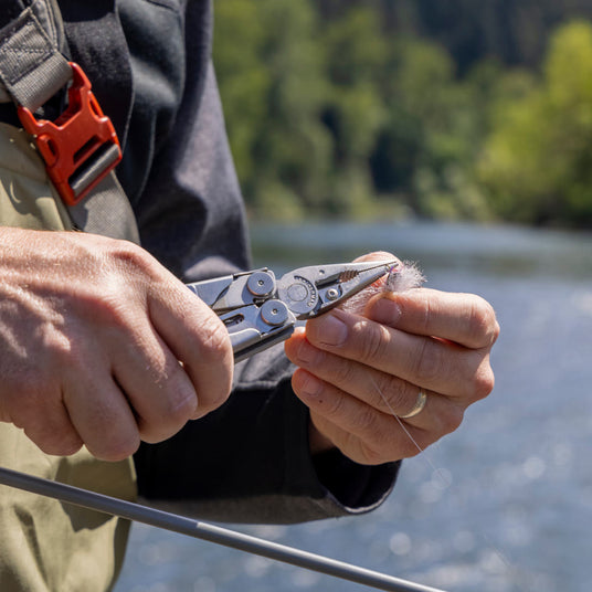 Wave Plus using pliers to adjust fishing hook