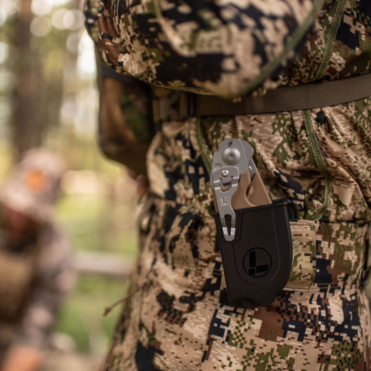 Raptor Rescue in a holster clipped to a Hunters pocket