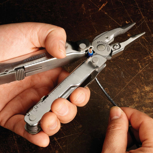 Man using Super Tool 300 electrical crimper to crimp the end of a wire