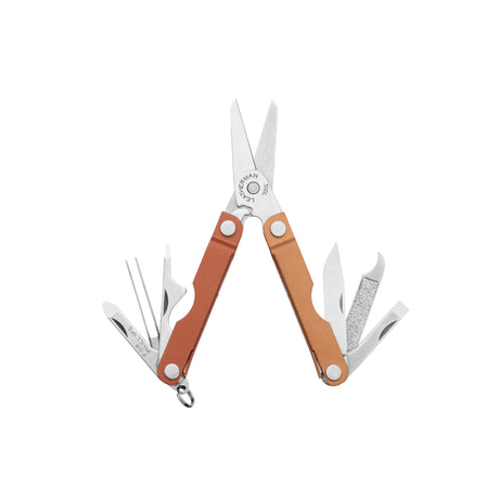 Translation missing: en.Leatherman Micra multi-tool in a Pumpkin Spice color, shown fully open to reveal its tools including scissors, nail file, knife, tweezers, screwdrivers, and bottle opener, all with a compact and functional design