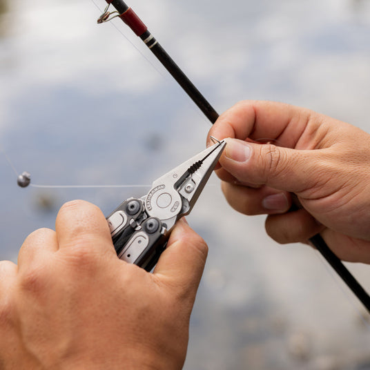 ARC pliers being used on a fishing hook