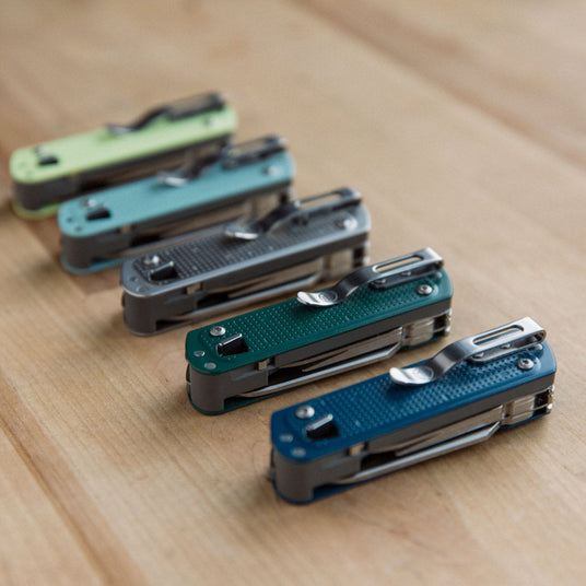 5 different colored FREE T4s lined up in a row on a wooden table