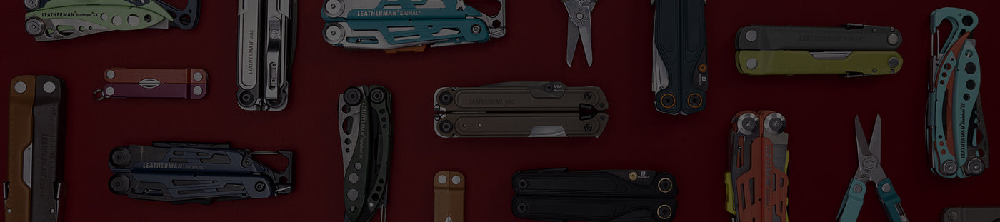 Translation missing: en.A variety of Leatherman tools in different styles are arranged on a vibrant red surface